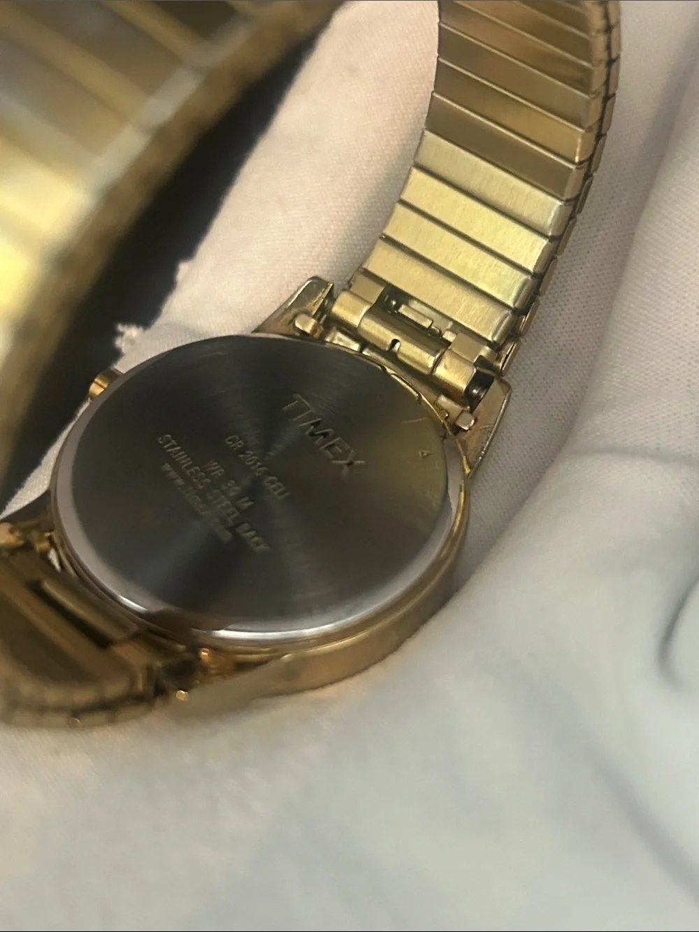 Timex Indiglo Men’s Gold Tone Watch with White Dial and Black Numerals